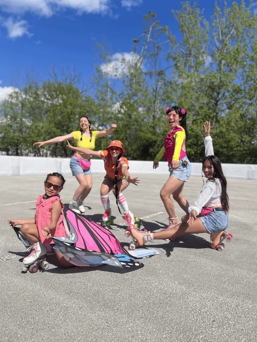 Young skaters resting on the ground after practice